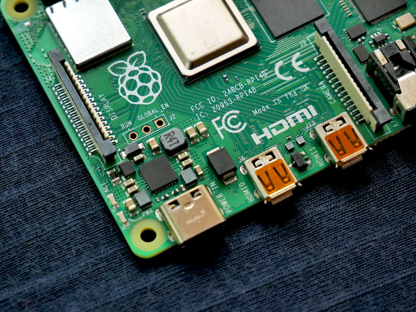 Electronic circuit board with HDMI ports and chips.