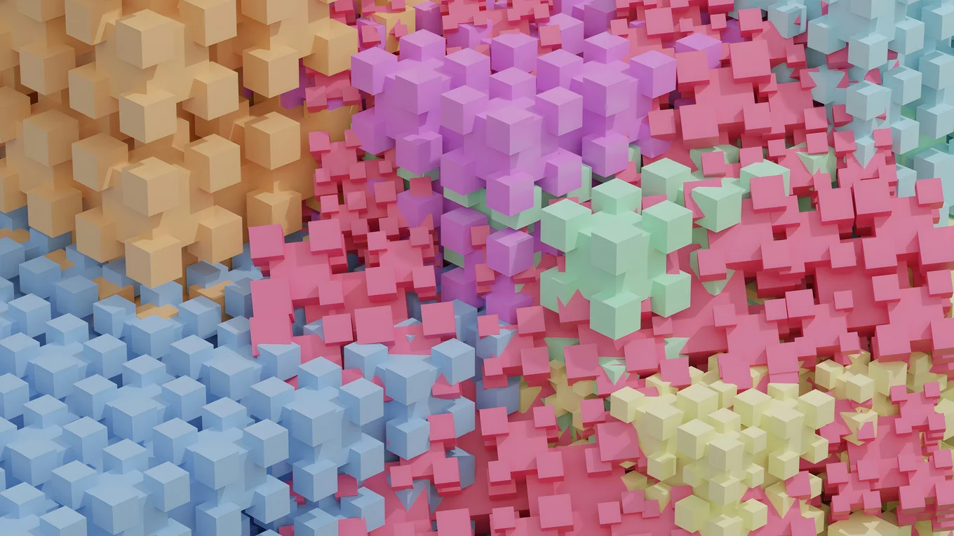 A 3d render of some abstract cubic shapes interlocking with each other. The shapes have different colours, including red, yellow, purple, and blue.